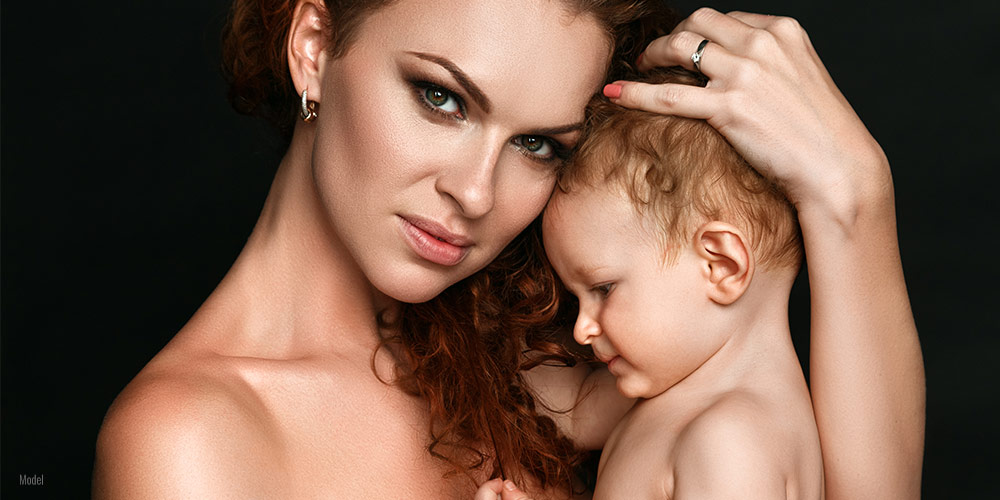 Mom holding a baby in her arm